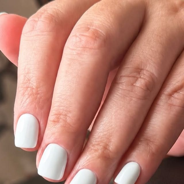 Short white gel manicure by Yuliia