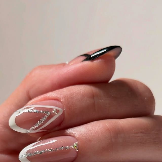 Black and white French manicure with glitter detail by Yuliia